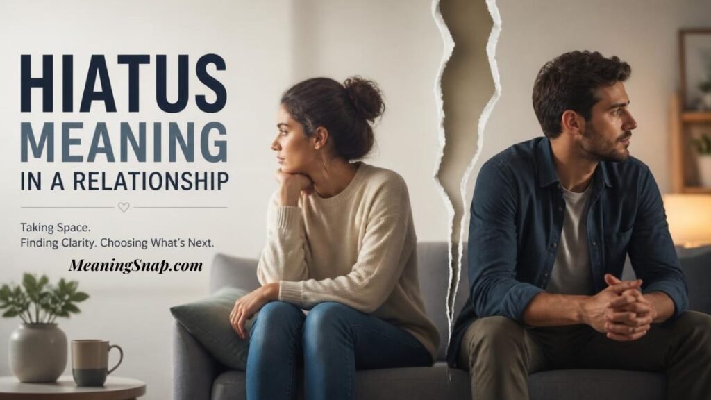 A man and woman sitting on a couch turned away from each other with a visual tear dividing them alongside headline text explaining the HIATUS MEANING IN A RELATIONSHIP.